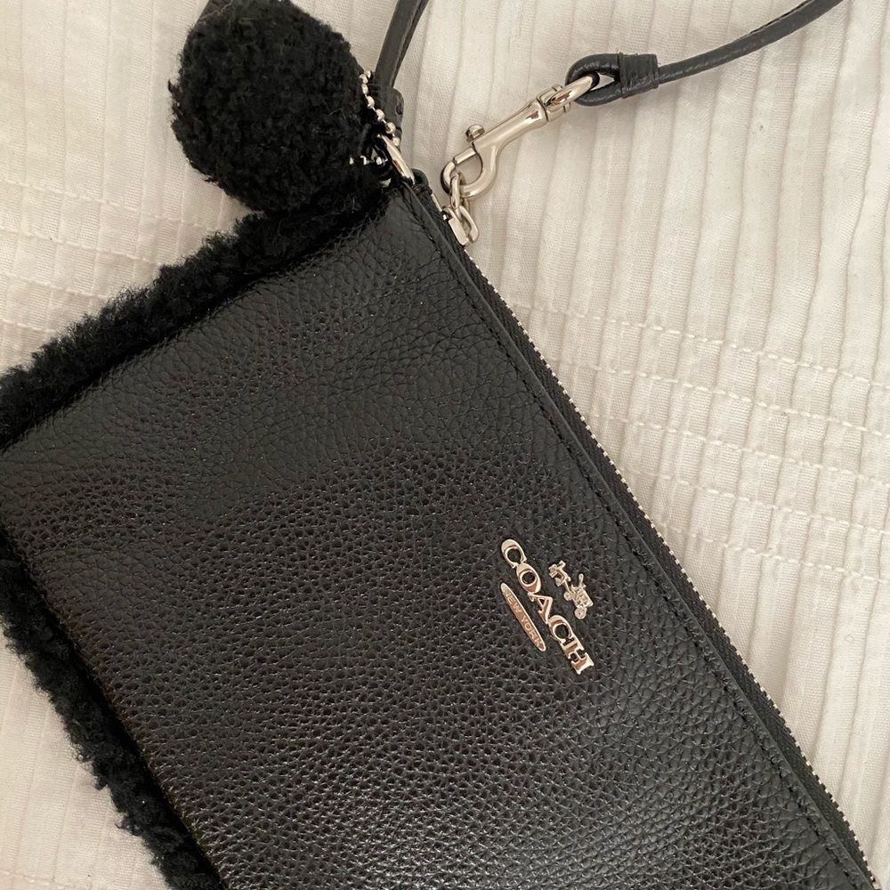 Coach black leather wristlet with Pom Pom keychain